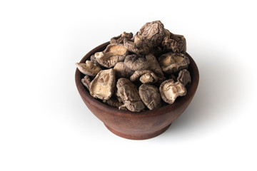Dried Shitake Mushroom   into a wooden bowl