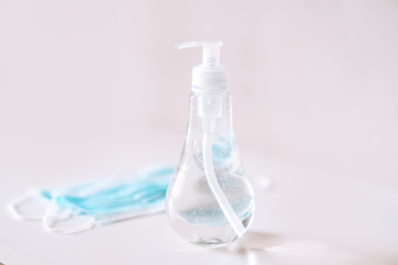 Coronavirus prevention medical  sterile masks and hand sanitizer gel for hand hygiene coronavirus protection. The concept of preventing the spread of the epidemic and treating  pandemic in quarantine 