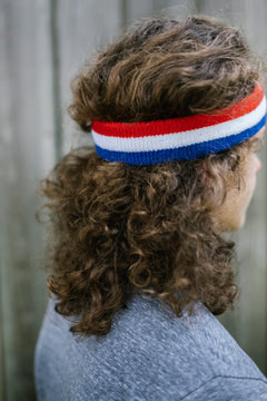 Close up Portrait of man wearing Red white and Blue Sweatband
