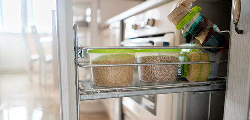 a kitchen accessories storage solutions, some dish and tablewear in the shelfs, home furniture