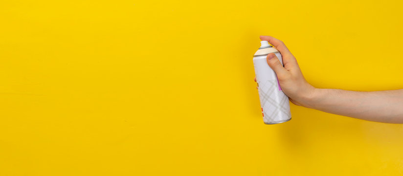 A Hand With A Spray Paint Can Isolated On A Colorful Background Mockup