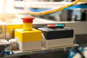 red stop button for emergency switching off the machine, a dangerous situation