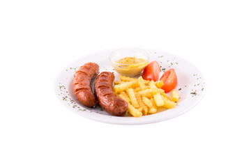 Grilled sausages with french fries, tomatoes and mustard. Served on a white plate. Photo taken on a white background. Dish of Montenegrin cuisine. Suitable for the restaurant menu.