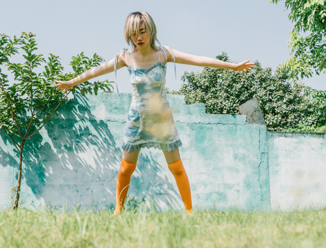 fashion woman falling on the grass