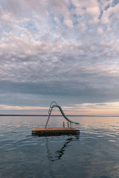 Floating Dock Slide At Lake in Serene Landscape