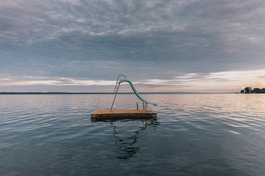 Lonely Floating Dock Slide At Lake