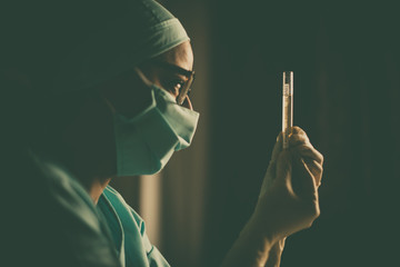 Doctor holding a coronavirus COVID-19 test tube