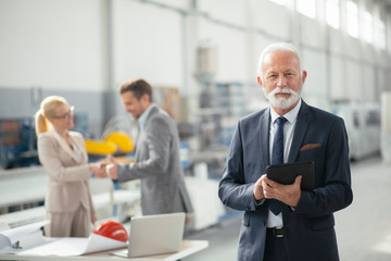 Handsome businessman using phone. Businessman talking to smart phone.	