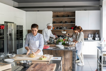 Kitchen class lesson with people cooking food