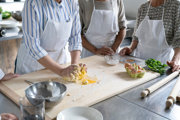 Women preparing food in a kitchen class