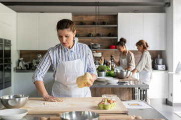 Kitchen class lesson with people cooking food