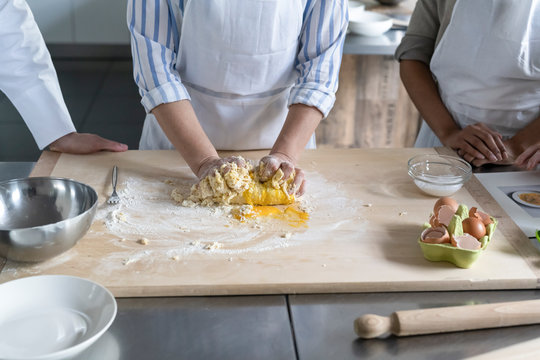 Women preparing food in a kitchen class