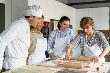 Making pasta during a kitchen lesson
