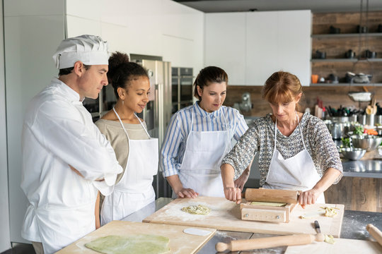 Making pasta during a kitchen lesson