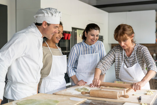 Making pasta during a kitchen lesson