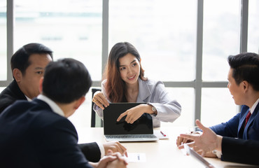 Business woman making a presentation at office. Business executive delivering a presentation to his...
