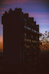 sunset over the city apartment building