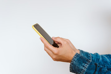 close up view of a woman using mobile phone indoors. Technology concept