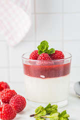 Italian dessert panna cotta with raspberries.