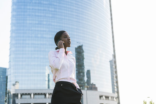 Businesswoman having a call in the city