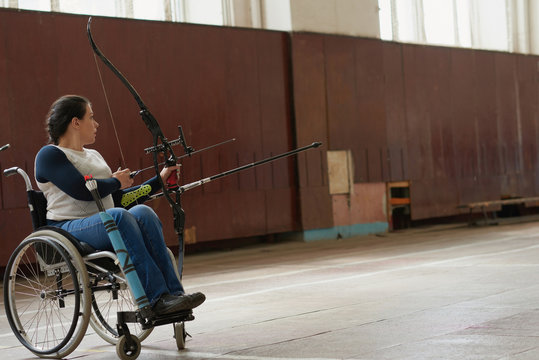 Professional Female Archer On Wheelchair