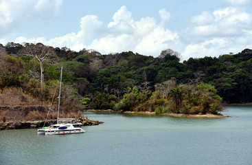 Fototapeta na wymiar Yacht sailing through the Panama Canal. 