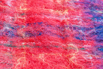abstract background of red and blue mohair scarf close up