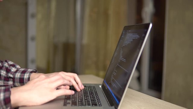 man coding html code web developer freelance programmer working