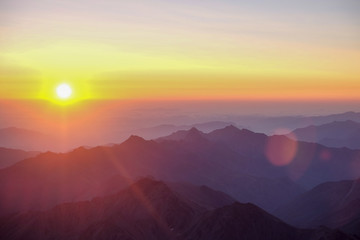 Obraz premium Dawn - sunset in the mountains with sunbeams