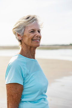 Portrait Of Senior Citizen With Natural Beauty Walking On Beach