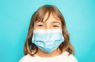 Masked child protection against virus. Selective focus.