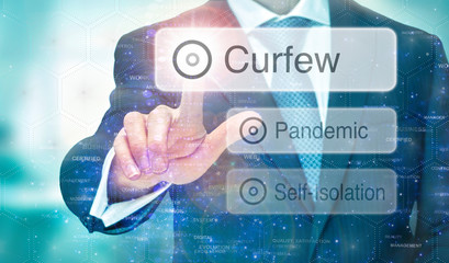 Fototapeta na wymiar A man selecting a message for Pandemic Curfew instructions on a blue digital screen.