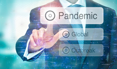 A man selecting message for   Global Pandemic instructions on a blue digital screen.