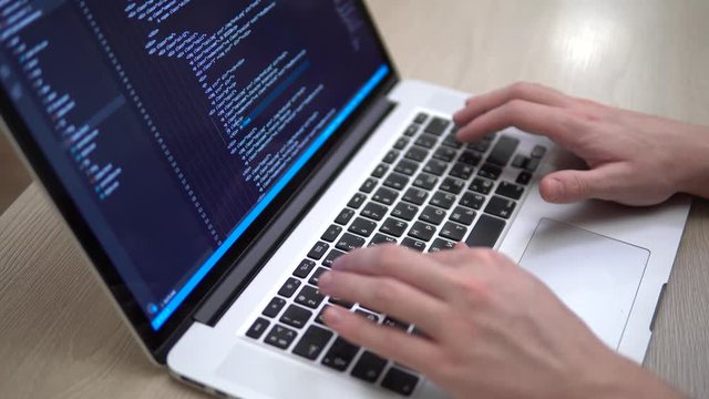 Closeup coding on screen, Man hands coding html programming on screen laptop