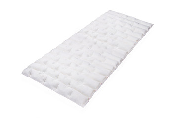 Orthopedic Anatomic Mattress isolated on white background. 3d illustration. Comfort sleep, good dreams. Soft white blanket. Latex and foam mattress with sleeping textile surface texture