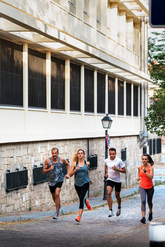 Athletes running in the street