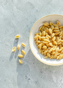Fresh pasta shells in ceramic bowl