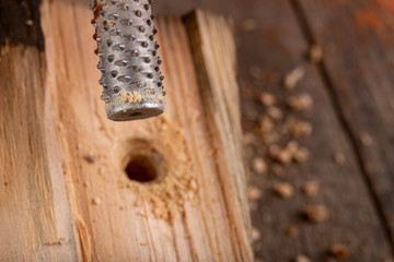 Countersinks for wood on a wooden table. Small carpentry work in the workshop.