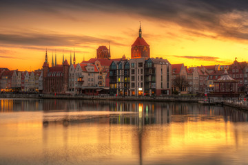 Obraz na płótnie Canvas Gdansk with beautiful old town over Motlawa river at sunset, Poland.