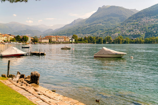 View of the bay at the Lugano in summer with boats in the lake
