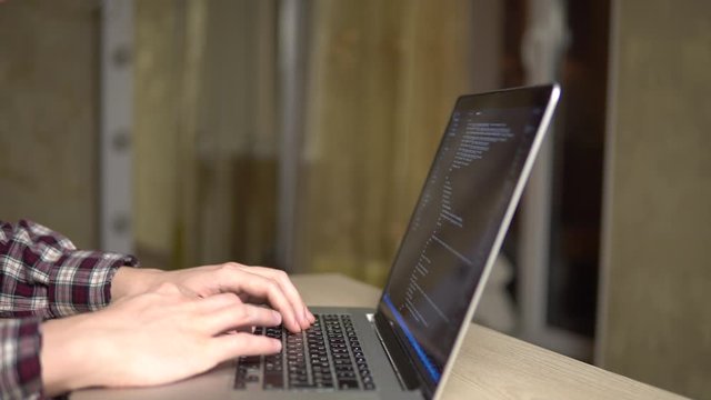 man coding html code website developer freelance programmer working at home