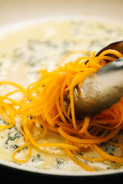 Cooking butternut squash noodles in sage butter