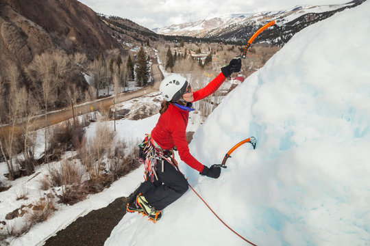 Woman climbs at ice park above Lake City, Colorado