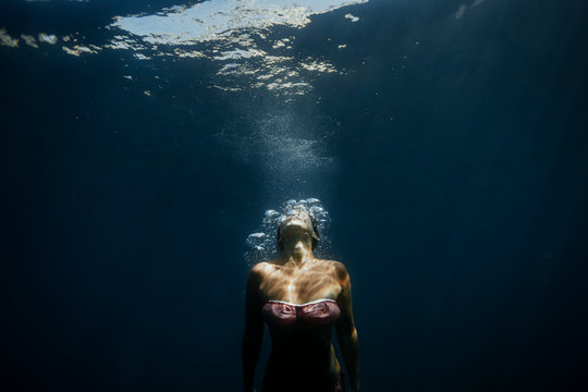 Woman swimming under Mediterranean Sea