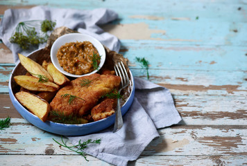 Fish and chips and mustard sauce.