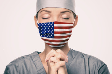 Coronavirus pandemic in the United States of America. USA american flag print on doctor's mask...