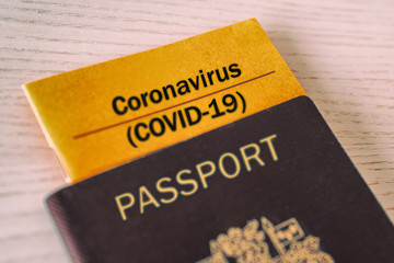 Coronavirus COVID-19 Vaccination proof booklet in passport. Travel ban health certificate Corona...