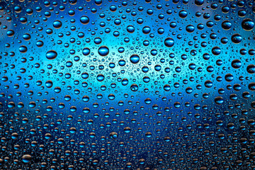 Water drops texture background. Rain on window glass. Wet rain pattern.