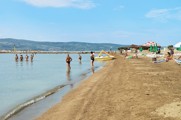 Fototapeta na wymiar People in beach at Adriatic Sea in Omis Croatia