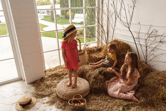 Children at Easter with rabbits and ducks